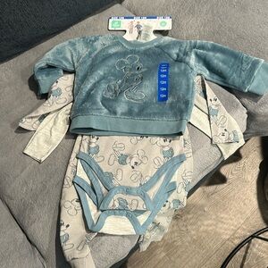 size 12m 
two onesies. one pants, and sweatshirt
Disney
